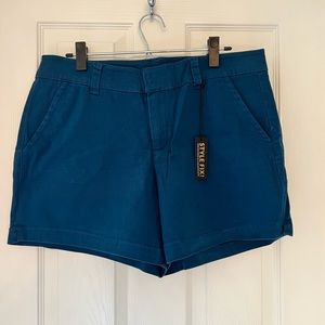 Navy Blue Shorts new with tags. Pockets with spandex.